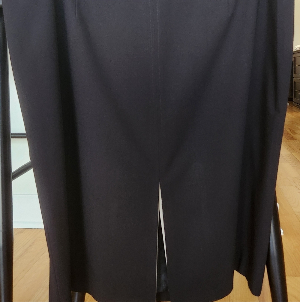 Capture Carolyn Bessette's style! Calvin Klein Black Midi Skirt with Front Slit